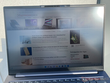 The Lenovo Yoga Slim 7i Pro 14IAP G7 in the sun