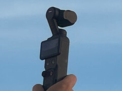 DJI Osmo Pocket compact camera with a blue sky behind it