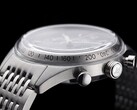 Side profile of the Timex Marlin Jet Chronograph showing its large domed Hesalite crystal, tachymeter scale, brushed stainless-steel case, pump-style chronograph pusher, Jet-branded crown, and stainless-steel bracelet