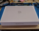 MacBook Neo retail box placed on a workbench before the teardown for SSD upgrade