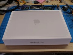 MacBook Neo retail box placed on a workbench before the teardown for SSD upgrade