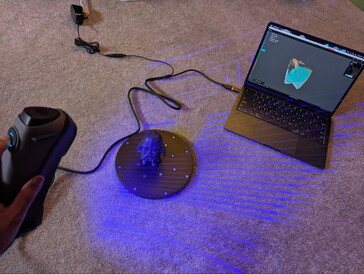 Sermoon S1 scanning the subject with cross line lasers and Creality Scan 4 app on MacBook Air