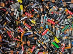 Shenhuo New Materials achieves mass production of ultra-thin 8-micron battery foil. Pictured: A pile of used consumer batteries. (Image source: John Cameron, Unsplash)