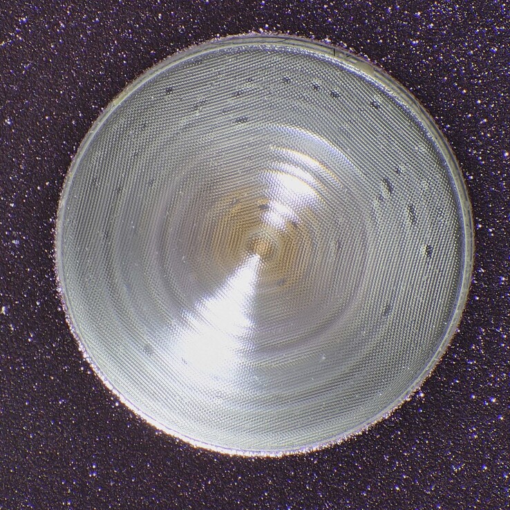 The Pixel 9 Pro flashlight opening with fresnel lens elements and a textured pattern to prevent hotspots