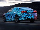 The heavily camouflaged VW ID.7 has now been unmasked by talented graphic designers (Image: Volkswagen)