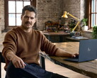 Henry Cavill sitting at a desk, Googlebook in reach