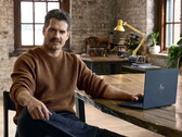 Henry Cavill sitting at a desk, Googlebook in reach