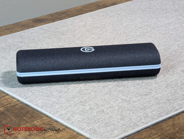 The charging case with its textured fabric exterior