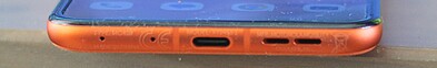 Bottom: 2x microphone, USB-C port, speakers