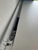 It is no problem to put a large power strip in the cable tray.