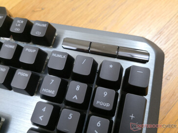 The three glossy buttons activate only when the keyboard is powered on
