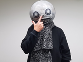 A picture of Nier's creator Yoko Taro wearing his mask