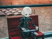 A humanoid robot sitting down