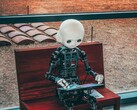 A humanoid robot sitting down