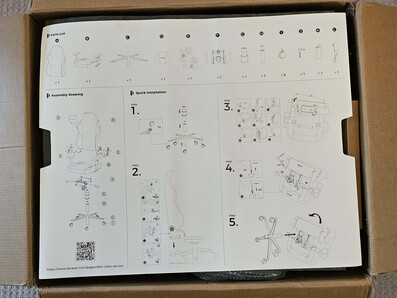 The assembly instructions come on a large piece of cardboard.