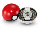 Casio G-Shock Pokémon 30th Anniversary GA-110 displayed inside a Poké Ball-shaped case with a decorative insert featuring 30 Pokémon.