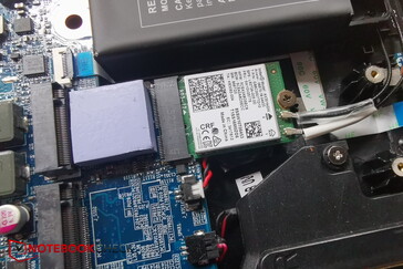 An unscrewed SSD reveals the AX201