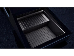A promotional image for Tesla&#039;s Cybertruck range extender battery pack, showcased in a Cybertruck&#039;s bed. (Image Source: Tesla)