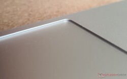 Deeply recessed touchpad has an inconvenient high edge