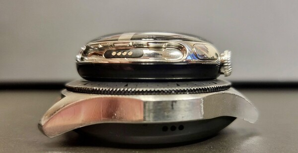 Pixel Watch stacked atop a Galaxy Watch offering a thickness comparison. At least maybe the charger will come with the device...(Image source: u/tagtech414 via reddit)