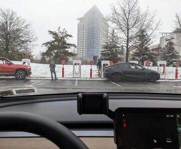 First Tesla Magic Dock Supercharger stall caught in the wild is being tested with a Rivian electric truck