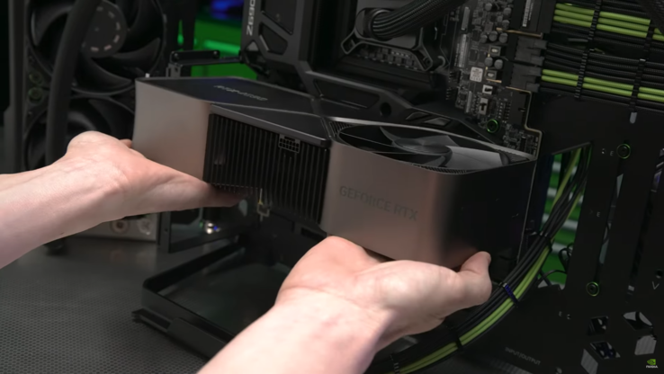 Nvidia GeForce RTX 4090 being slotted into the motherboard (image via Nvidia)