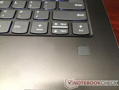 Half-sized arrow keys and fingerprint sensor