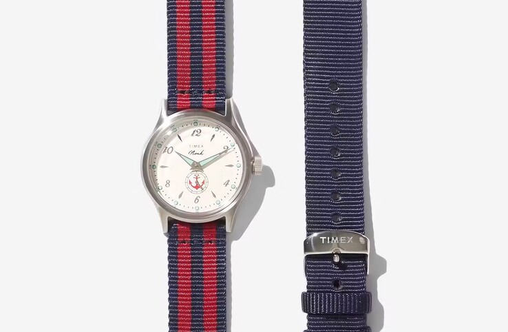 The Noah x Timex MK1 Anchor with a red/black fabric strap shown alongside a solid blue strap.