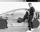 Franz with one of the initial Robotaxi prototypes (Image source: Tesla/Walter Isaacson)