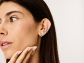 A model wearing the Lumia 2 smart earrings.