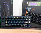 Lemokey L1 HE Keychron K4 HE Hall effect keyboards on a desk in front of a box and laptop