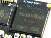 The MetaVRain chip is smaller than a regular coin. (Image Source: YouTube) 