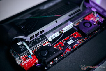 You have to remove one ribbon cable before you can take the back cover off.