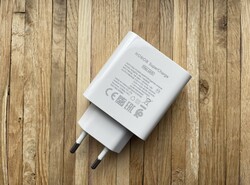 The included 100-watt power adapter