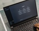 Hands typing on a laptop keyboard with the ChatGPT start page on screen