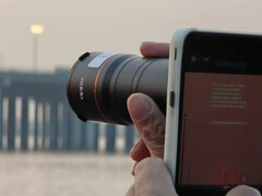 The Find X9 Ultra in action with its official teleconverter accessory attached. (Image source: via Weibo)
