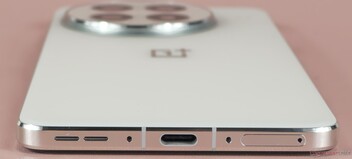 Bottom: Loudspeaker, microphone, USB port, microphone, SIM slot
