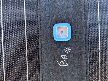 If the shadow of the point is in the center of the circle, then the panel is perfectly aligned
