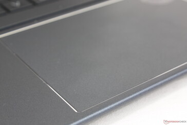 Chrome-cut perimeter around the clickpad. Traction is smooth with minimal sticking at medium-to-fast speeds
