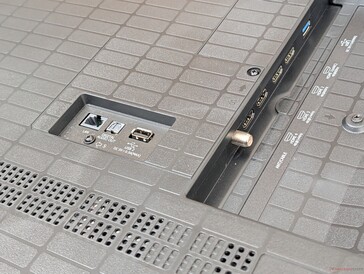 The LAN, audio, and USB ports protrude directly from behind the TV for poor cable management