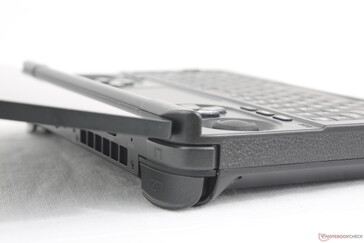 Lid can open almost the full 180 degrees. Hinge rigidity is stiff with no teetering during use