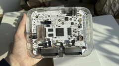 Transparent $200 SuperStation One Lite FPGA console prototype showing its internal circuit board