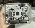 Transparent $200 SuperStation One Lite FPGA console prototype showing its internal circuit board