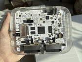 Transparent $200 SuperStation One Lite FPGA console prototype showing its internal circuit board
