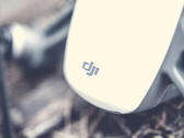 A closeup of DJI's logo on a drone.