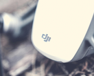 A closeup of DJI's logo on a drone.