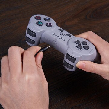 The mod kit charges via a special 3.5mm to USB cable. (Image source: 8BitDo)