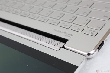 Two speakers are within the hinge while the other two are near the front corners of the base