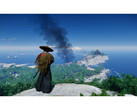 A landscape shot from Ghost of Tsushima showcasing Jin standing on a mountain overlooking the island. (Image Source: Steam)