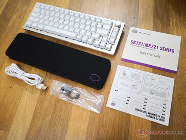 Retail box includes the keyboard, wireless dongle, USB-C to USB-A cable, key remover, manual, quick start guide, and soft wrist rest